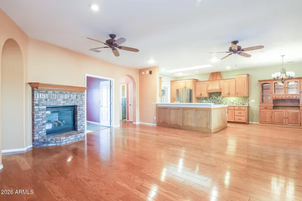 a view of a kitchen with a sink and a fireplace