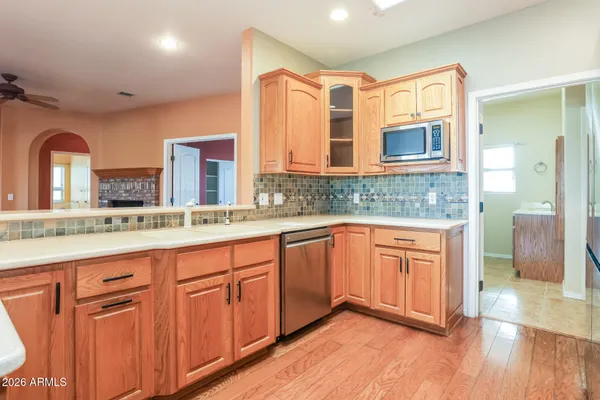 a spacious bathroom with double vanity and a mirror