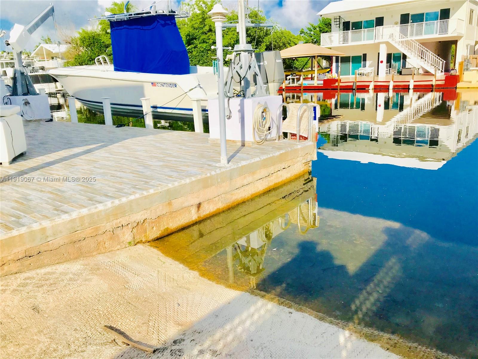 30 Jean Lane Key Largo, FL 33037 - Photo 15 of 17 a view of swimming pool with building exterior