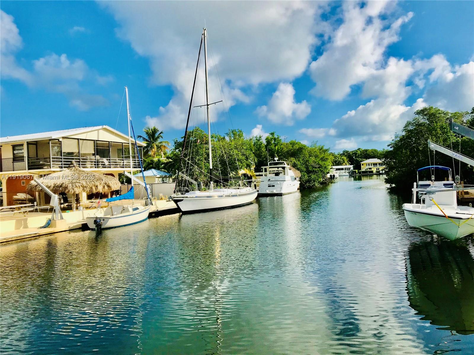 30 Jean Lane Key Largo, FL 33037 - Photo 5 of 17 a view of a lake with couches and city view