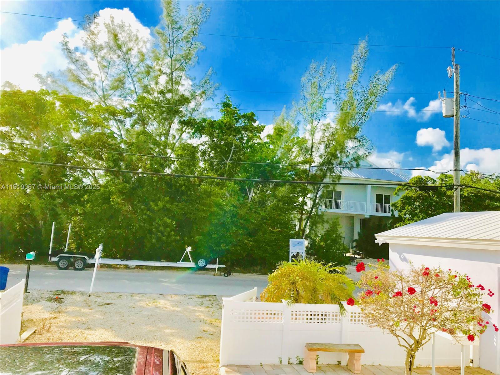 30 Jean Lane Key Largo, FL 33037 - Photo 8 of 17 a view of a fountain in front of house