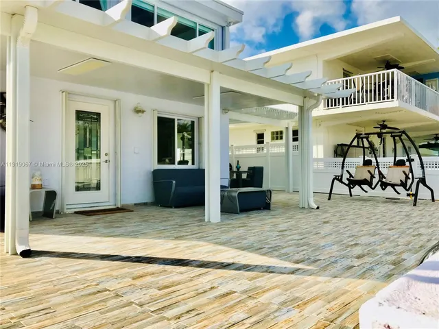a view of a livingroom with a patio and furniture