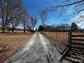 5900 Allen Black Road Stallings, NC 28104 - Photo 1 of 9 a view of outdoor space with wooden fence