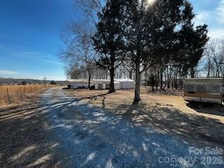 5900 Allen Black Road Stallings, NC 28104 - Photo 3 of 9 a view of house with snow on the road