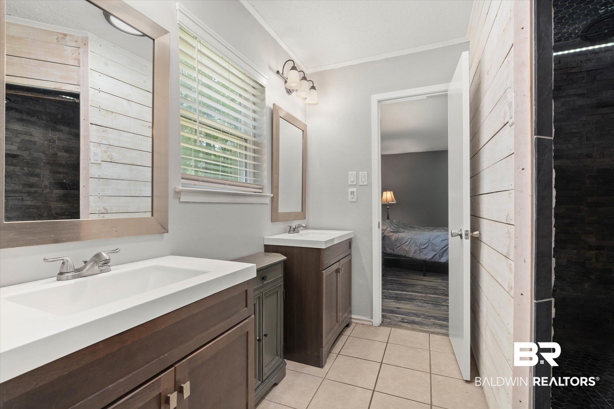 1025 Walter Smith Road Mobile, AL 36695 - Photo 26 of 46 Ensuite bathroom featuring two vanities, tile patterned flooring, and ornamental molding