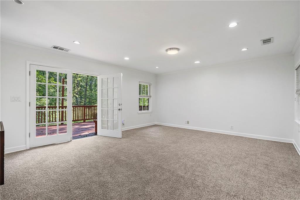 1190 West Wesley Road Northwest Atlanta, GA 30327 - Photo 18 of 46 an empty room with windows