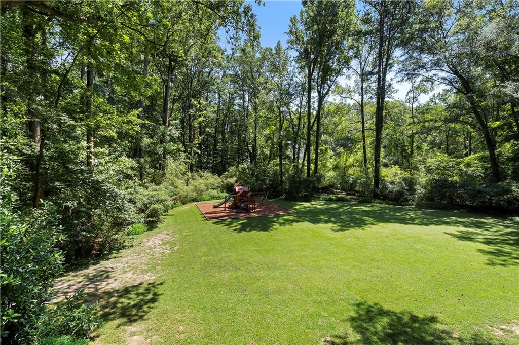 1190 West Wesley Road Northwest Atlanta, GA 30327 - Photo 22 of 46 a view of a tree in a yard