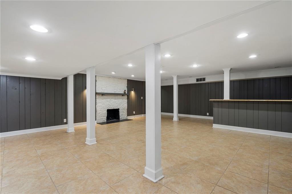 1190 West Wesley Road Northwest Atlanta, GA 30327 - Photo 32 of 46 a view of an empty room with a fireplace