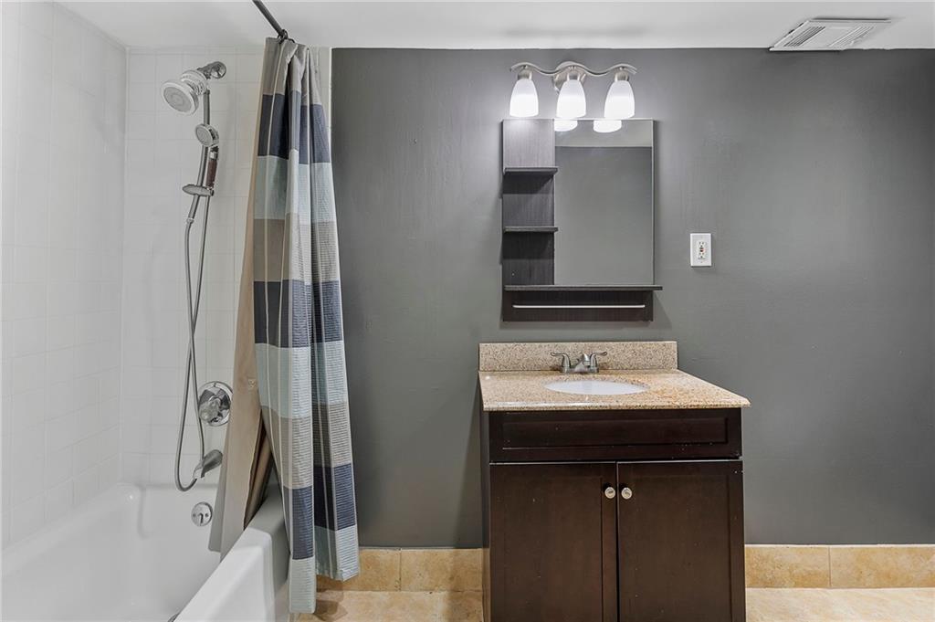 1190 West Wesley Road Northwest Atlanta, GA 30327 - Photo 35 of 46 a bathroom with a sink and a mirror