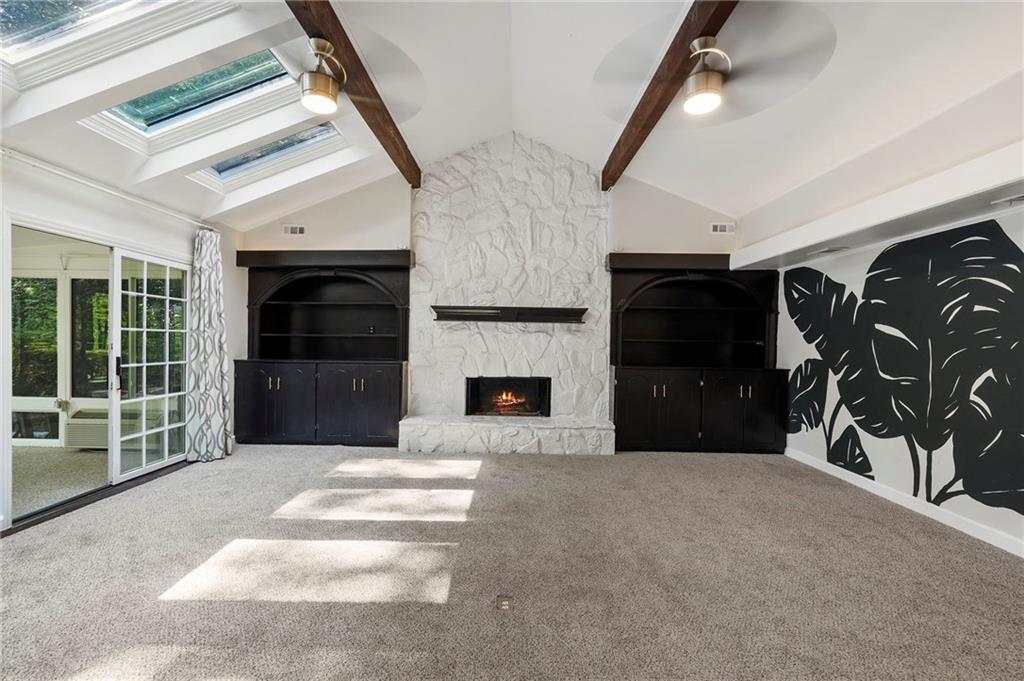 1190 West Wesley Road Northwest Atlanta, GA 30327 - Photo 4 of 46 a living room with furniture and a fireplace
