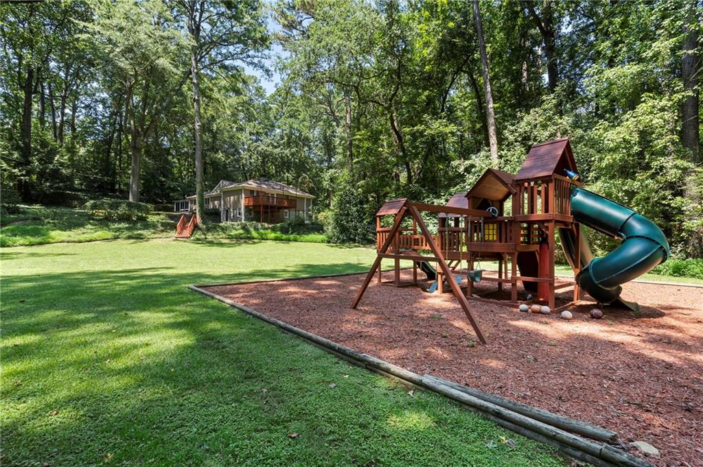 1190 West Wesley Road Northwest Atlanta, GA 30327 - Photo 45 of 46 a view of outdoor space with playground and green space