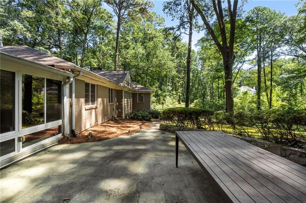 1190 West Wesley Road Northwest Atlanta, GA 30327 - Photo 7 of 46 a view of a house with backyard and sitting area