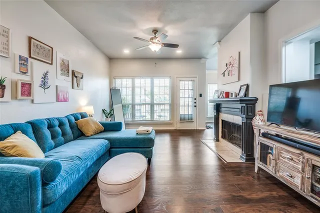 a living room with furniture and a fireplace