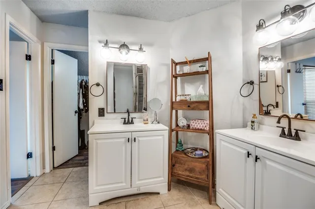 a bathroom with a sink and mirror