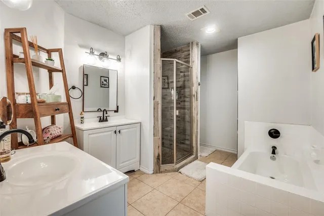 a bathroom with a bathtub sink and mirror