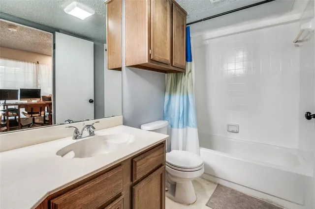 a bathroom with a sink a toilet and a bathtub