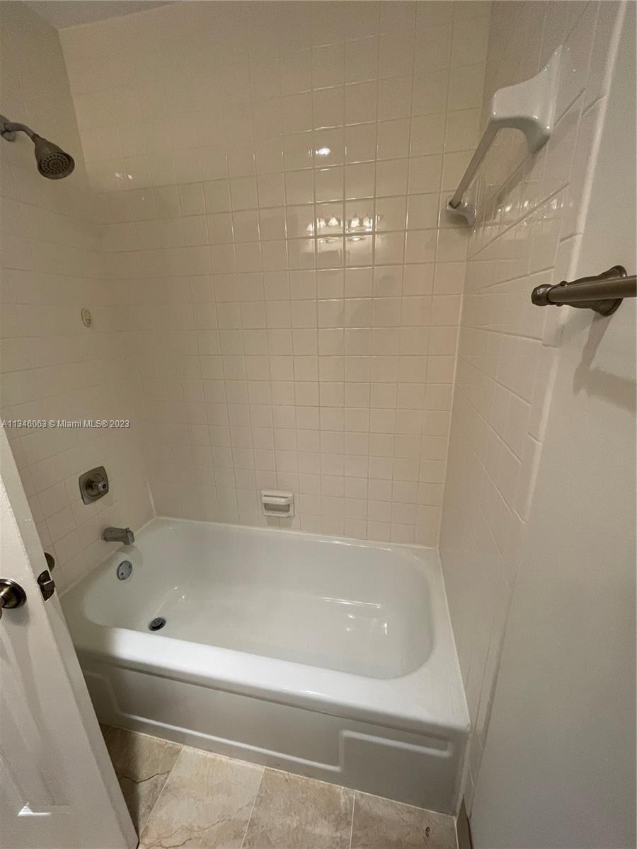 2201 Southwest 15th Street, Unit 252 Deerfield Beach, FL 33442 - Photo 11 of 12 a bathroom with a bathtub