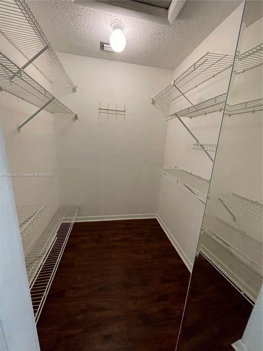 2201 Southwest 15th Street, Unit 252 Deerfield Beach, FL 33442 - Photo 10 of 12 a view of a room with racks on the wall