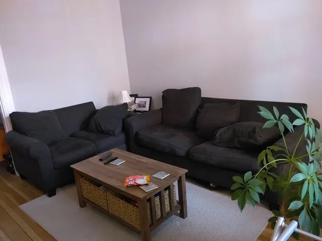 a couch sitting in a living room with a couch