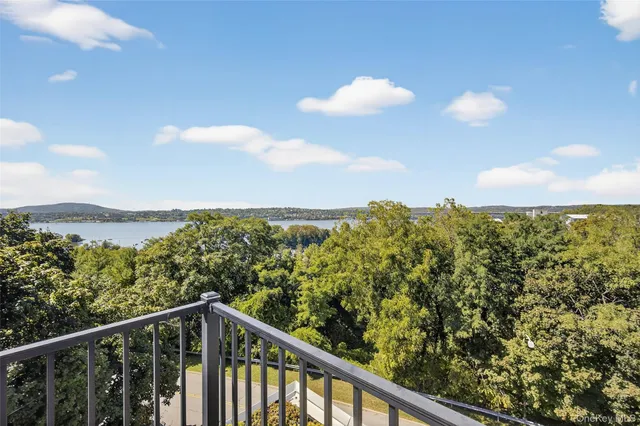 a view of a balcony with chairs