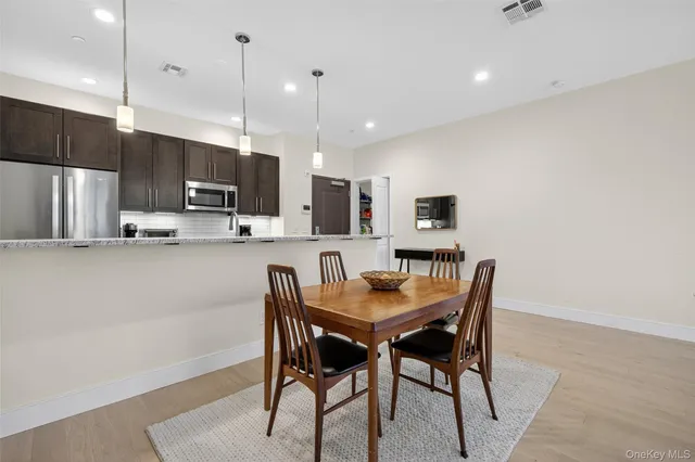 a view of a dining room with furniture