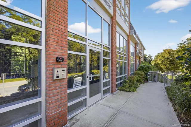 a view of a building with a potted plant and a large window