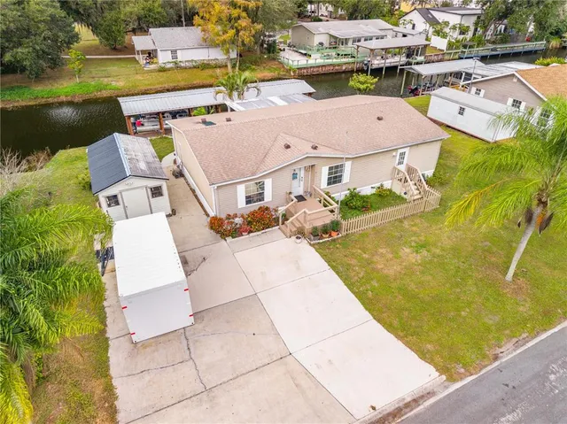 an aerial view of a house with outdoor space