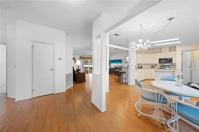 a view of a kitchen and dining room