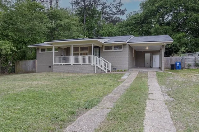 front view of a house with a yard