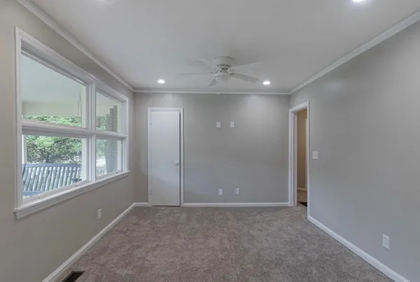 a view of an empty room with a window
