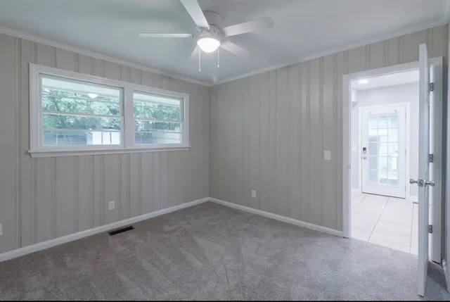 a view of an empty room with a window