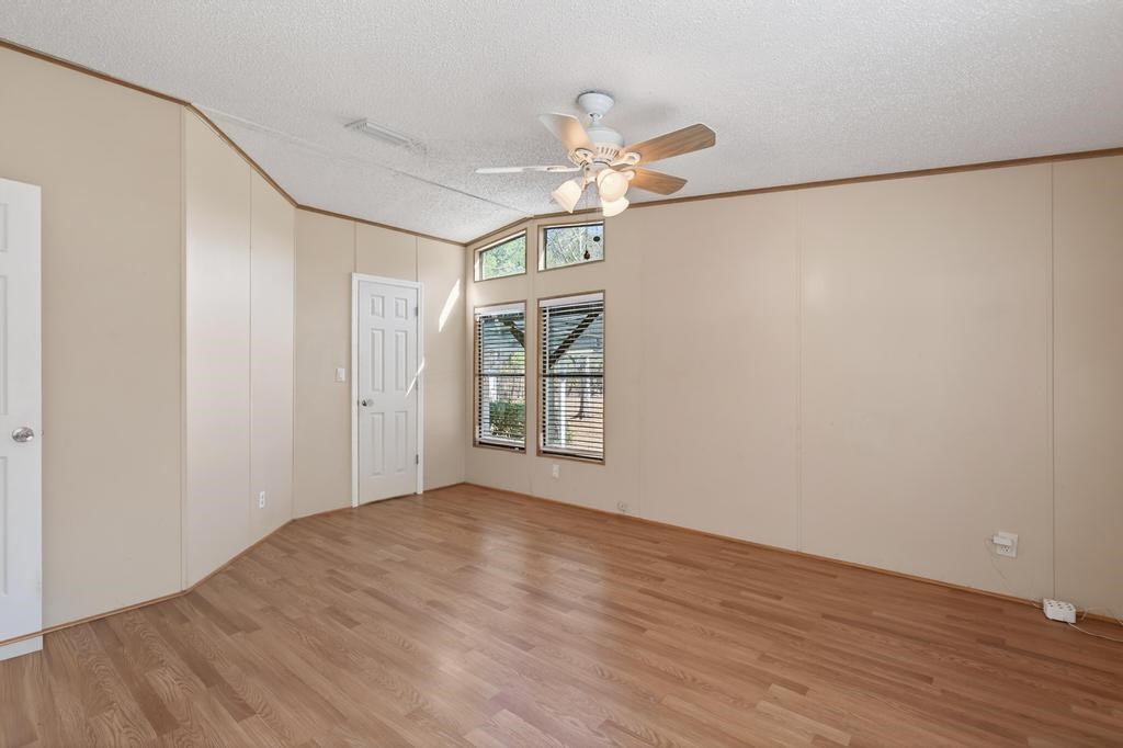 2744 Roy Sikes Road Hilliard, FL 32046 - Photo 49 of 97 a view of an empty room with wooden floor and a window
