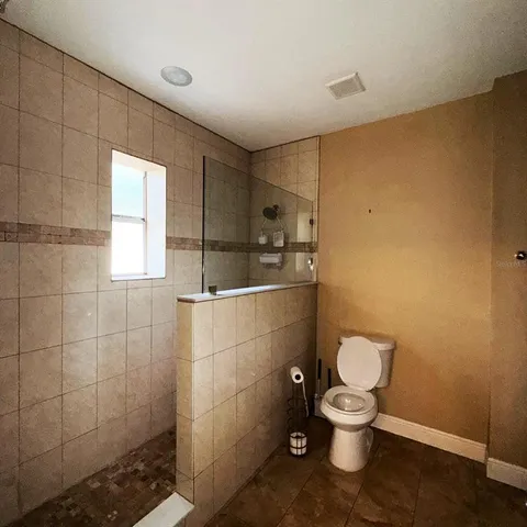 a spacious bathroom with a double vanity sink and mirror