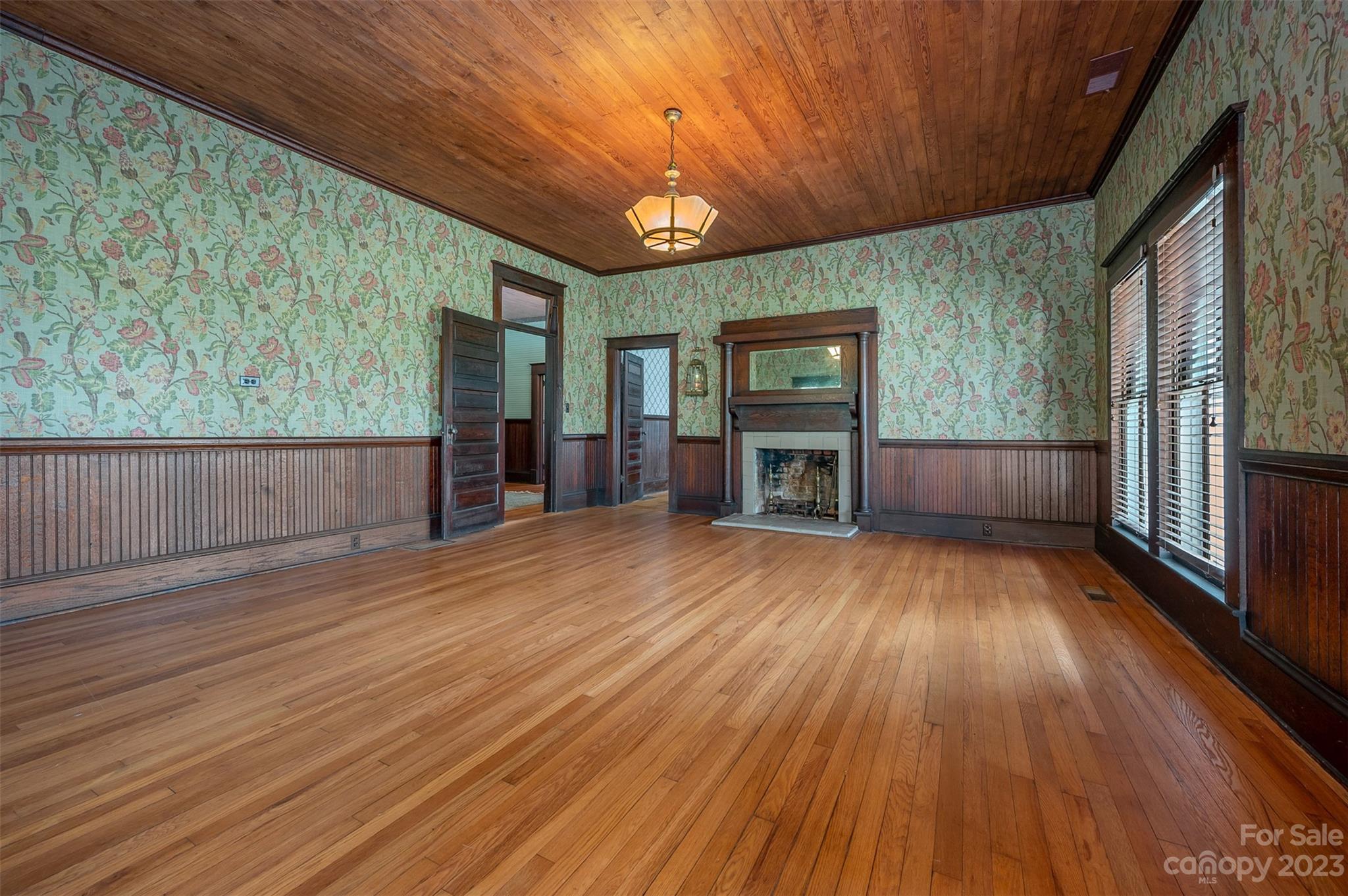 141 Wilson Road Rutherfordton, NC 28139 - Photo 8 of 48 a view of empty room with wooden floor and fan