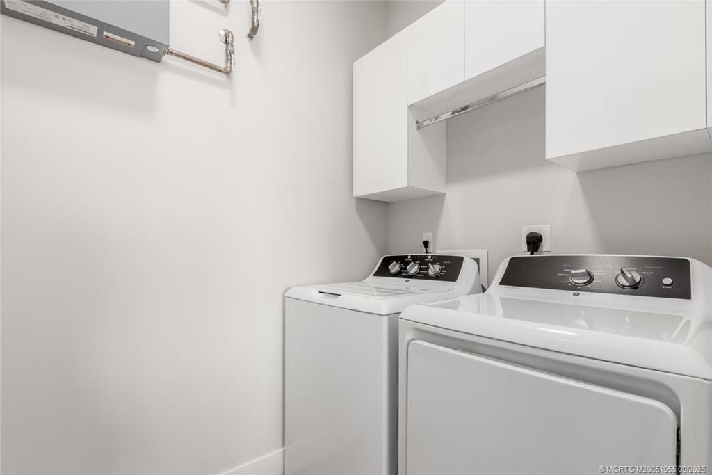 41 Southwest Seminole Street, Unit 203 Stuart, FL 34994 - Photo 20 of 20 a utility room with dryer and washer