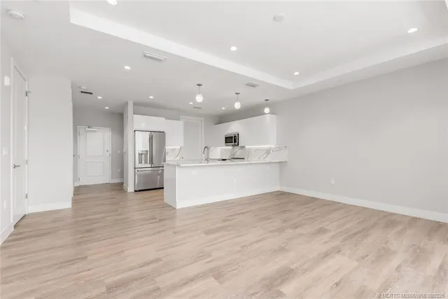 a view of kitchen with wooden floor