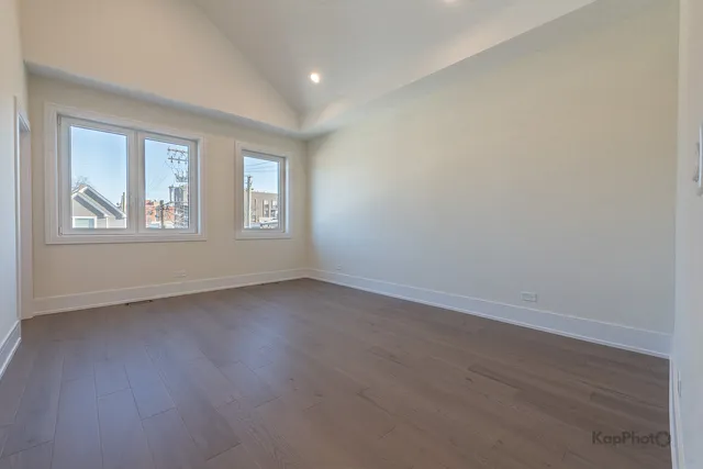 a white bath tub sitting next to a shower