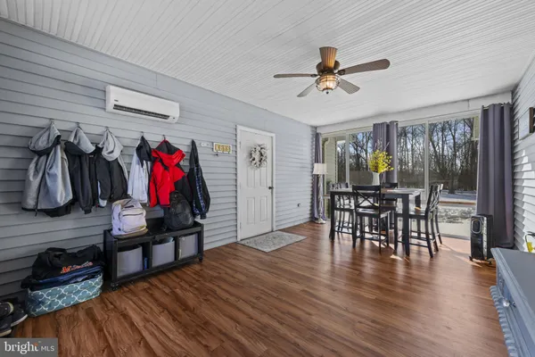 a view of a dining room with furniture window and wooden floor