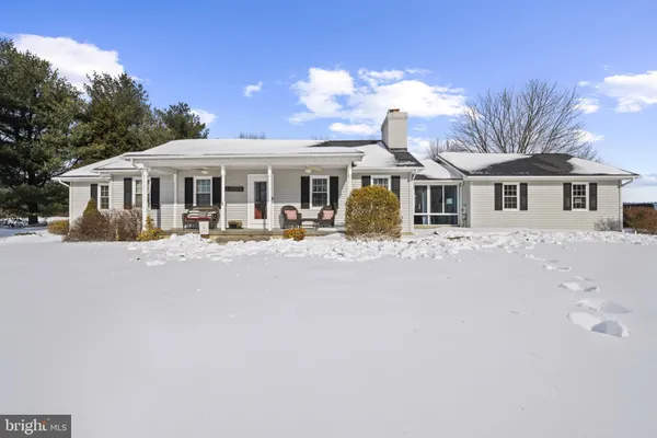 a front view of a house with a porch