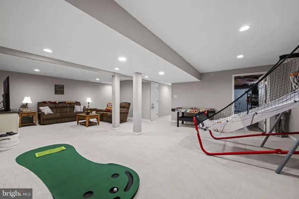 a living room with furniture gym equipment and a view of living room