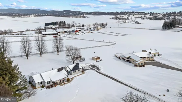 a view of a terrace with outdoor seating and city view