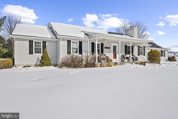 a front view of house with yard outdoor seating and barbeque oven