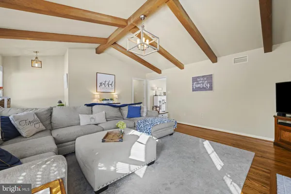 a living room with furniture and a rug