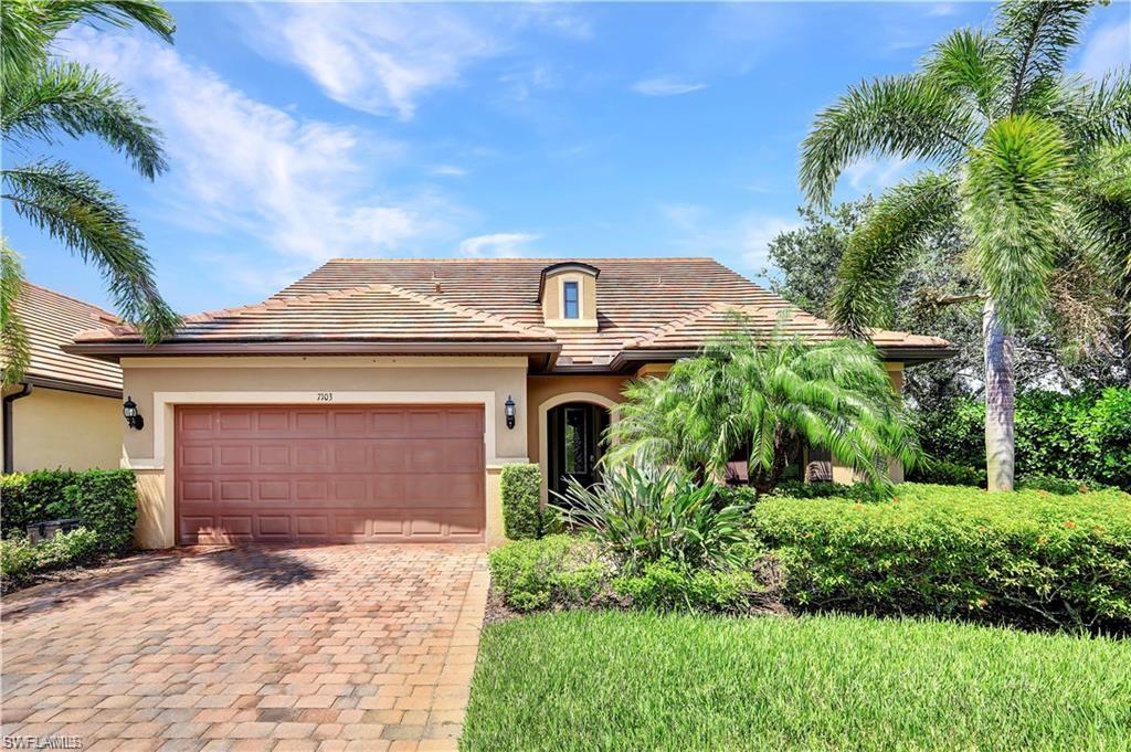 7103 Lily Way Naples, FL 34114 - Photo 1 of 41 a front view of a house with a yard