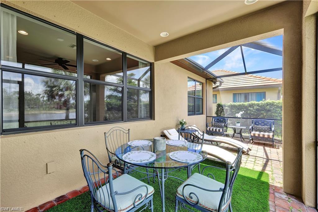 7103 Lily Way Naples, FL 34114 - Photo 16 of 41 a outdoor dining space with furniture and garden view