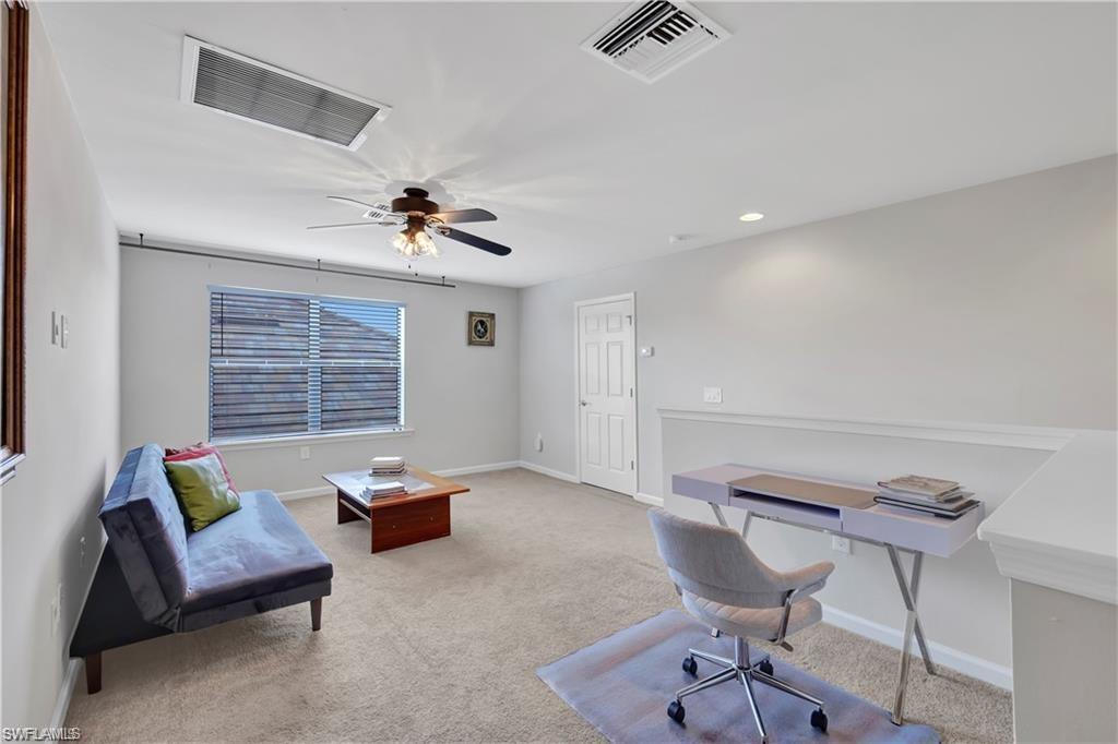 7103 Lily Way Naples, FL 34114 - Photo 23 of 41 a living room with furniture and a window
