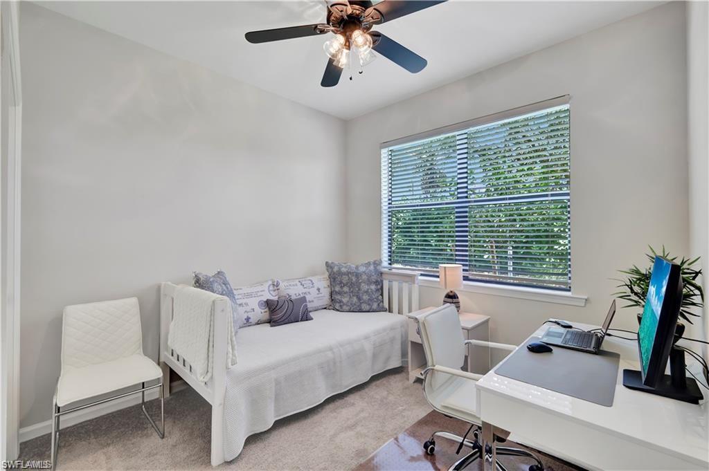 7103 Lily Way Naples, FL 34114 - Photo 28 of 41 a bedroom with a bed and a desk