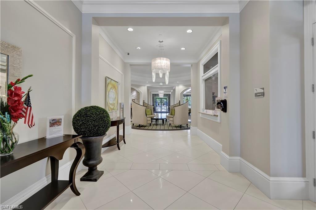7103 Lily Way Naples, FL 34114 - Photo 30 of 41 a view of hall way with furniture and chandelier