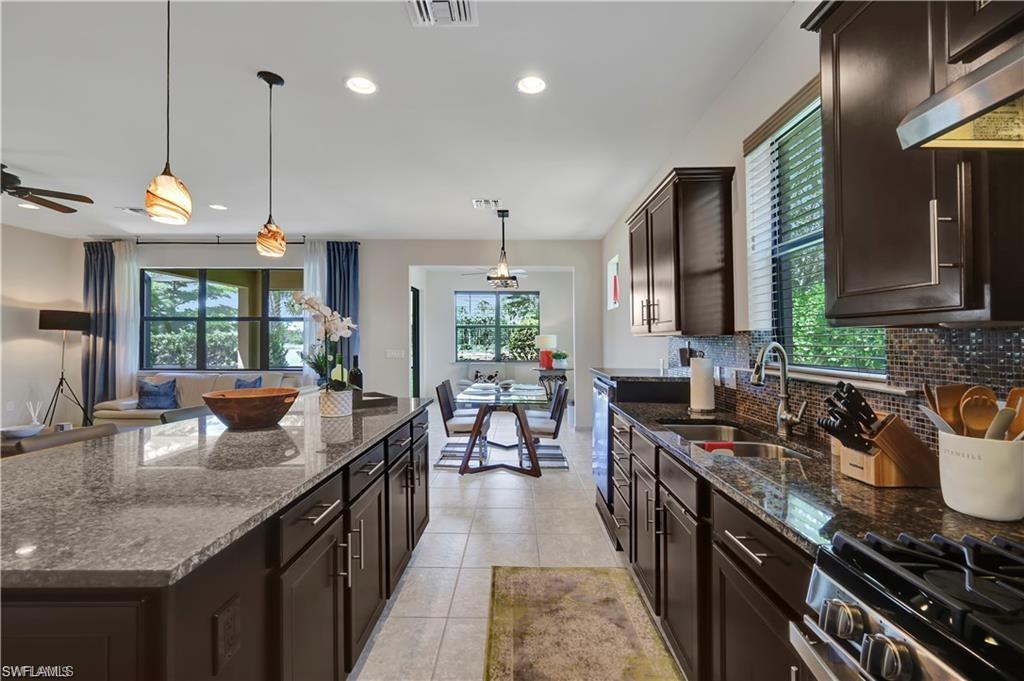 7103 Lily Way Naples, FL 34114 - Photo 6 of 41 a kitchen with lots of counter space