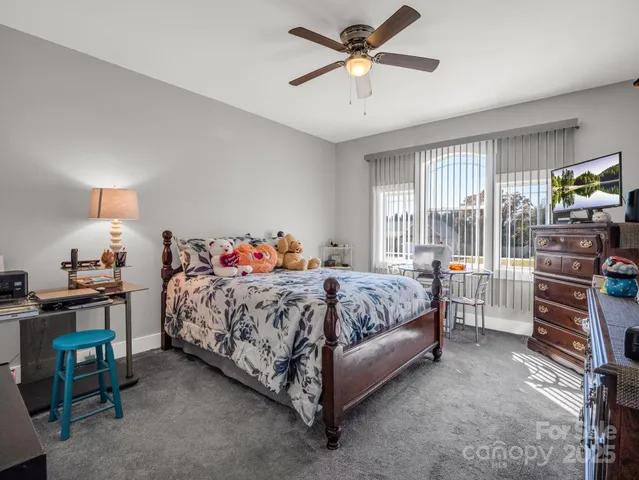 a bedroom with a bed and cabinets